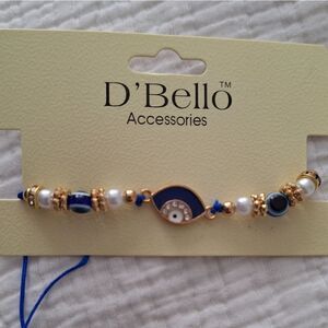 NWT Bracelet eye protection charm, stretch, god tone beads, blue, white beads